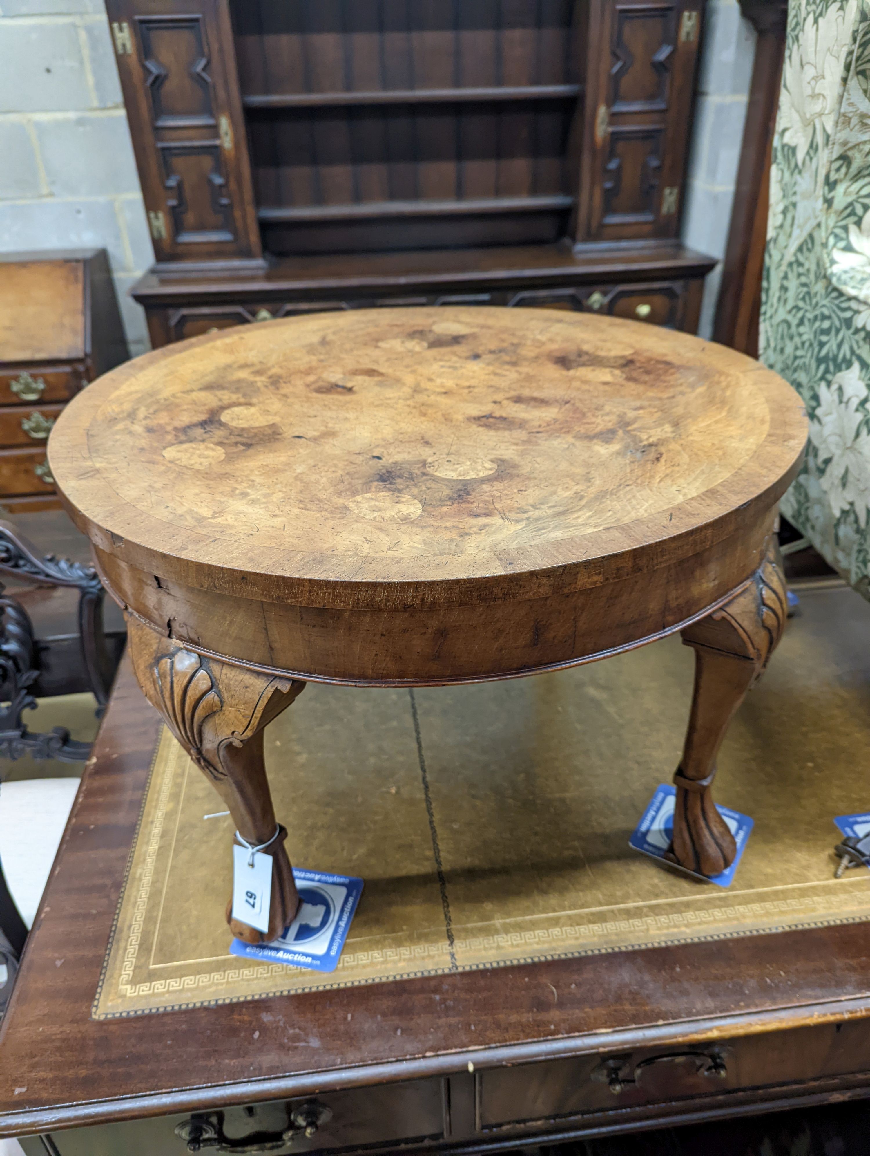 A Queen Anne revival circular walnut occasional table, diameter 60cm, height 40cm together with an Arts & Crafts mirrored oak coat rack